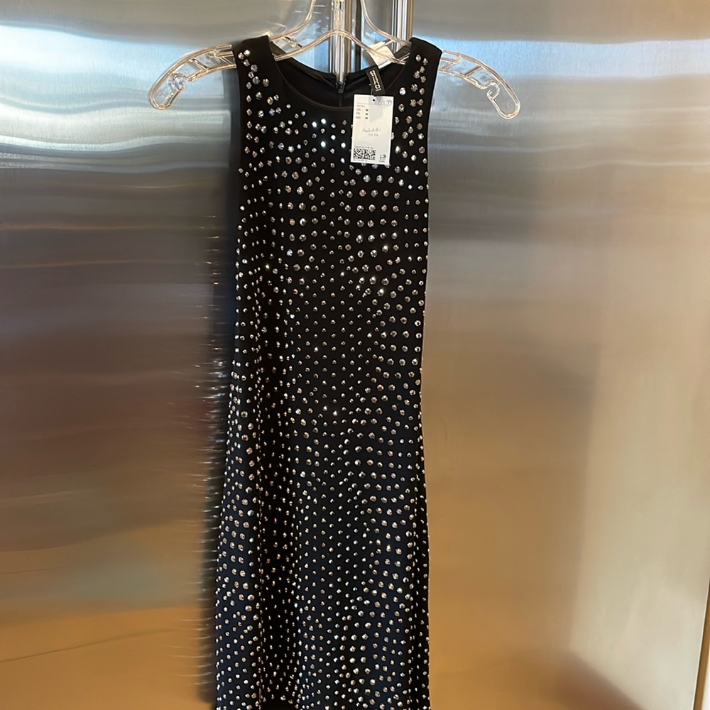 Black fully lined dress with silver studs.
